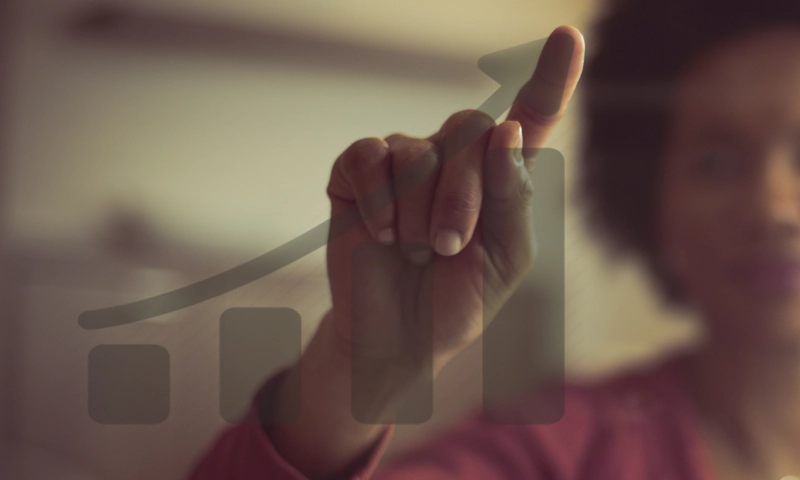 A hand pressing a touchscreen